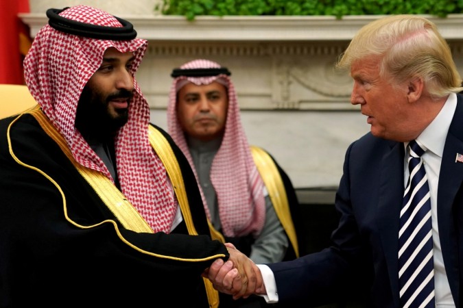 FILE PHOTO: U.S. President Donald Trump shakes hands with Saudi Arabia's Crown Prince Mohammed bin Salman in the Oval Office at the White House in Washington, DC, U.S. March 20, 2018. Saudi Arabia's Crown Prince Mohammed bin Salman in the Oval Office