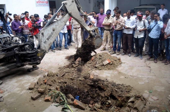 Digging work underway in the premises of Seva Sankalp Evam Vikas Samiti, a state-run shelter home on Sahu Road in Muzaffarpur to exhume the body of girl who was suspected to be buried after beaten up badly. Picture taken: July 23, 2018. Bihar shelter home rape