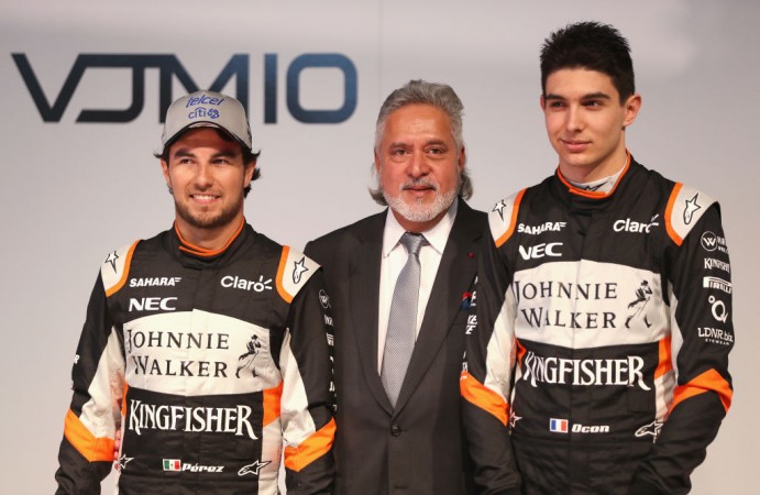 File photo of F1 drivers Sergio Perez (L) and Esteban Ocon with Force India co-owner Vijay Mallya. Force India F1