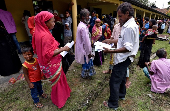 Villagers wait outside the National Register of Citizens (NRC) centre to get their documents verified by government officials, at Mayong Village in Morigaon district, in the northeastern state of Assam. (File Picture) Assam NRC