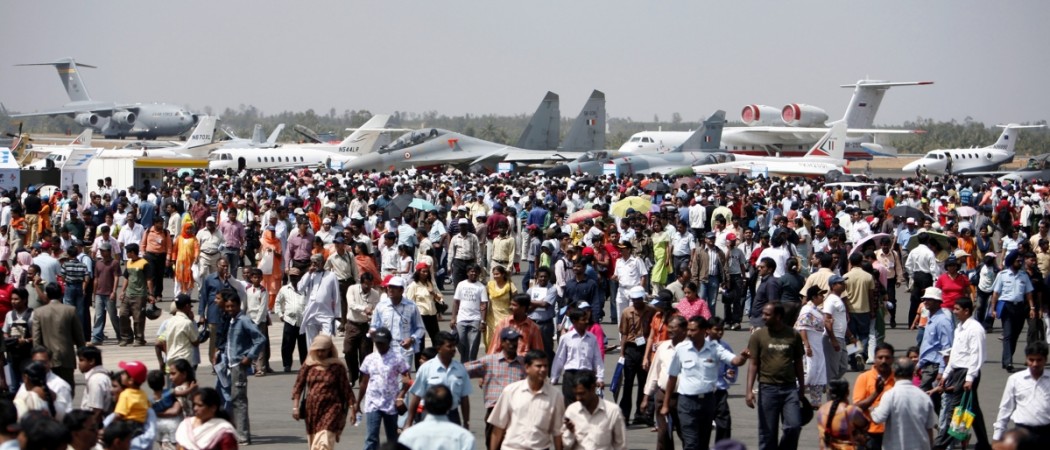 Spectators crowd the static display zone during the 'Aero India 2007' air show at the Yelahanka air force station on the outskirts of Bangalore February 10, 2007. Spectators at the 2007 Bangalore air show