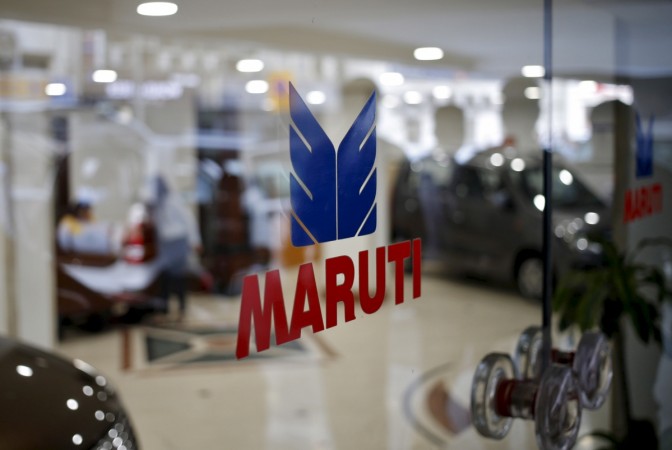 The logo of Maruti Suzuki India Limited is seen on a glass door at a showroom in New Delhi, India, February 29, 2016. The logo of Maruti Suzuki India Limited