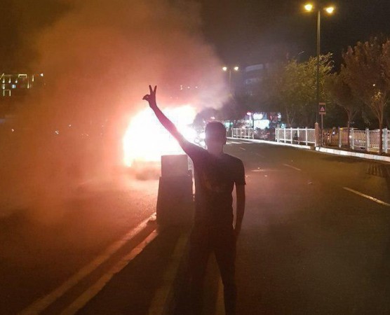 A youth in Iran protesting the renewal of American sanctions Protests in Iran