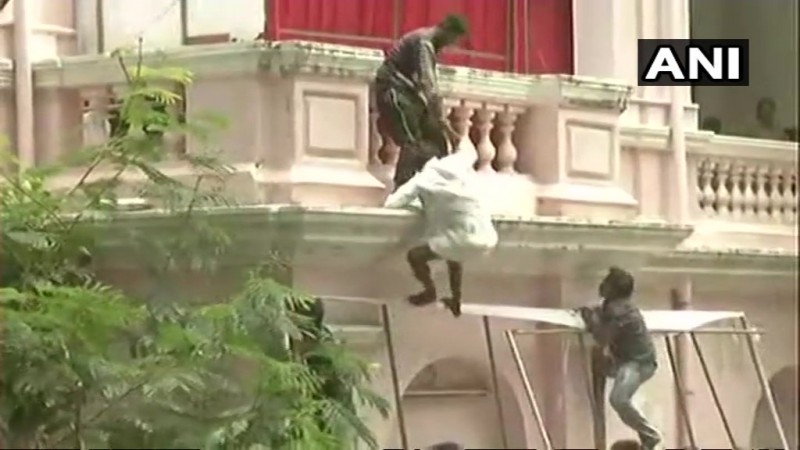 A few people have climbed the wall of the Rajaji Hall to enter the venue. Karunani funeral