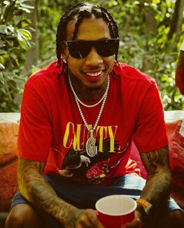 Tyga is reportedly happy seeing Lindsay Lohan's Instagram comment Tyga