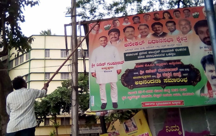From advertising hoardings to flexes of party campaigns, the BBMP has torn down 21,000 illegal displays across the city since August 1. An illegal hoarding promoting the Congress party being torn down by the BBMP