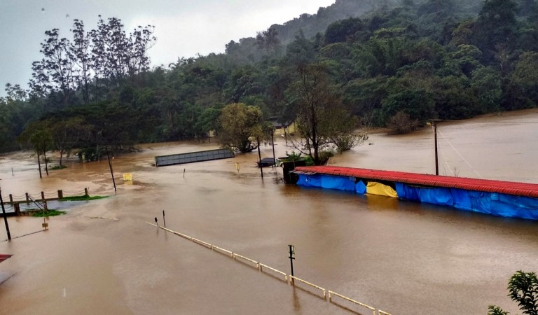 A view of Bhagamandala temple area flooded due to heavy rains at Bhagamandala in the Kogadu district of Karnataka on Aug 14, 2018. Torrential rains up to 30 cm lashed Karnataka's coastal and south interior districts, causing landslides and disrupting normal life. Bhagamandala temple in Coorg inundated