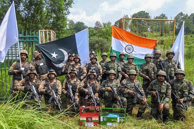 Indian and Pakistan Army celebrated Eid by exchanging sweets at Chakan Da Bagh Crossing point, near Poonch, Jammu and Kashmir, on August 22, 2018. Indian and Pakistan Army celebrated Bakra Eid by exchanging sweets at Chakan Da Bagh Crossing point, near Poonch on August 22, 2018.