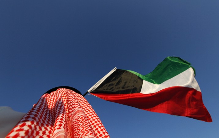 A Kuwaiti national holding the flag. Kuwaiti flag