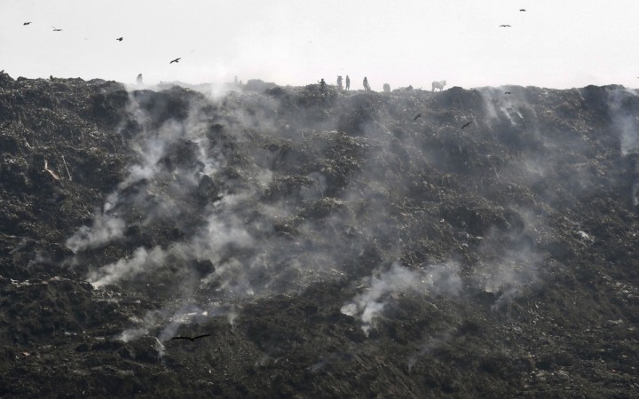 Landfill causes pollution and fires. (In file: Smoke emerges from a burning garbage dump at a landfill on the outskirts of New Delhi on October 13, 2017.) landfill