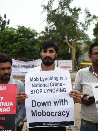 Indian activists take part in a protest against mob lynchings in India, in Ahmedabad on July 23, 2018. - More than 20 people have been killed in similar incidents in the past two months, leaving both the Indian authorities and Facebook-owned WhatsApp scrambling to find a solution in its biggest market fake news