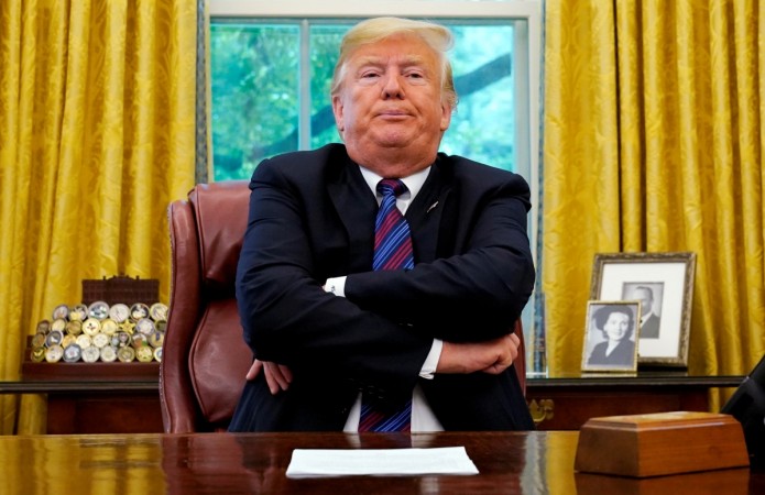 U.S. President Donald Trump sits behind his desk as he announces a bilateral trade agreement with Mexico to replace the North American Free Trade Agreement (NAFTA) at the White House in Washington, U.S., August 27, 2018. Donald Trump