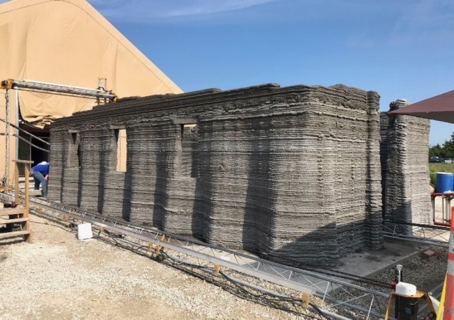The world's largest concrete 3D printer constructs a 500-square-foot barracks hut at the U.S. Army Engineer Research and Development Center in mid-August in Champaign, Illinois. 3D Printed Barracks
