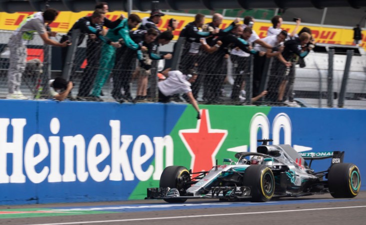 Mercedes team celebrate on the pit wall as race winner Lewis Hamilton Lewis Hamilton