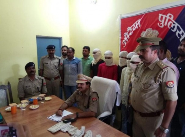The Auraiya Police team with the arrested gang members and the recovered arms. (Credit: Auraiya Police) Haryana ola driver kidnapping accused