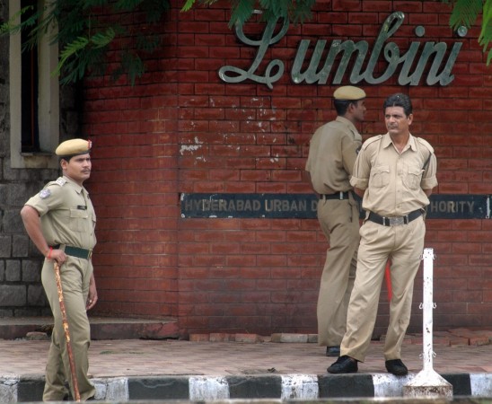 Indian policemen stand guard outside the Lumbini Park, the site of a 25 August bomb blast, in Hyderabad, 27 August 2007. A strike called by right-wing Hindu nationalists kept many people off work and shut schools 27 August after twin bomb blasts blamed on Islamic militants killed 42 civilians in this Indian city. hyderabad twin blasts