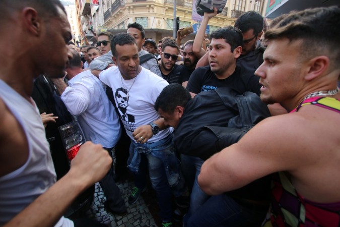 People surround a man suspected of stabbing Brazilian presidential candidate Jair Bolsonaro Jair Bolsonaro