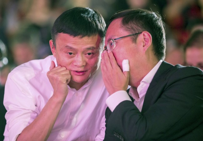 Alibaba Group's CEO Zhang speaks to executive chairman Ma during the launch event of Alibaba's Tmall. alibaba