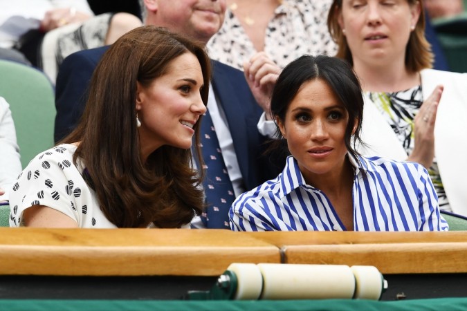 LONDON, ENGLAND - JULY 14: Catherine, Duchess of Cambridge and Meghan, Duchess of Sussex attend day twelve of the Wimbledon Lawn Tennis Championships at All England Lawn Tennis and Croquet Club on July 14, 2018 in London, England. Kate Middleton and Meghan Markle