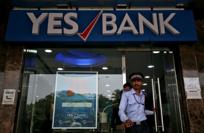 A watchman steps out of a Yes Bank branch in Mumbai, September 21, 2018 yes bank