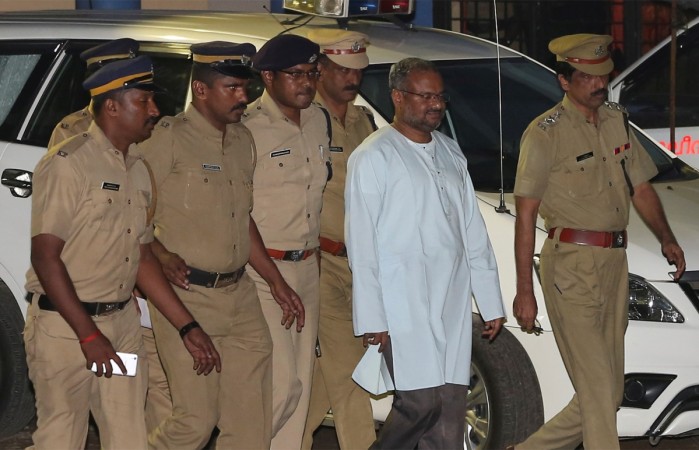 Bishop Franco Mulakkal (2nd R), accused of raping a nun, is escorted by police outside a crime branch office on the outskirts of Kochi in the southern state of Kerala, India, September 21, 2018. franco mulakkal