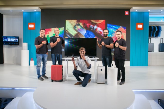 From Right--Eshwar Chandrasekaran, Lead, Mi TV Business, Manu Jain, Vice President, Xiaomi and Managing Director, Xiaomi India, Sudeep Sahu, Product Manager, Mi TV Business India & Raghu Reddy, Head - category & online sales, Xiaomi India. Xiaomi, Mi TV 4A Pro, Mi Air Purifier 2S, Mi Band 3, Mi Home Security Camera 360, Mi Luggage