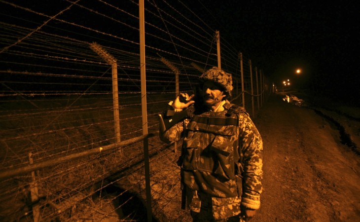 A BSF jawan on patrol along the fence on the Line of Control (LoC). BSF jawan