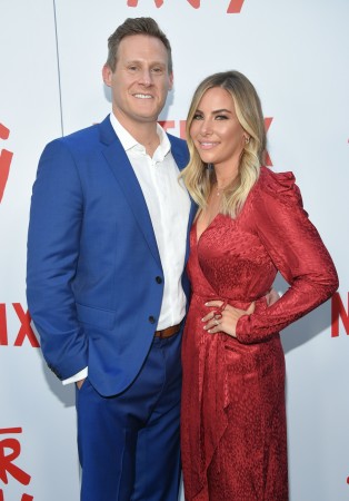 Producer Trevor Engelson (L) and Tracey Kurland arrive for the Netflix premiere of 'The After Party' at the Arclight theater in Hollywood on August 15, 2018. Producer Trevor Engelson (L) and Tracey Kurland