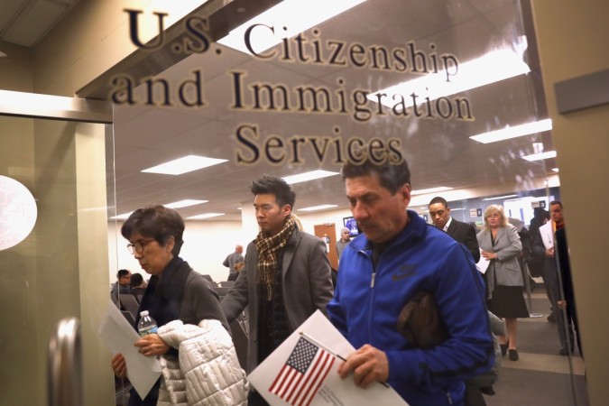 Immigrants prepare to become American citizens at a naturalization service on January 22, 2018 in Newark, New Jersey. USCIS