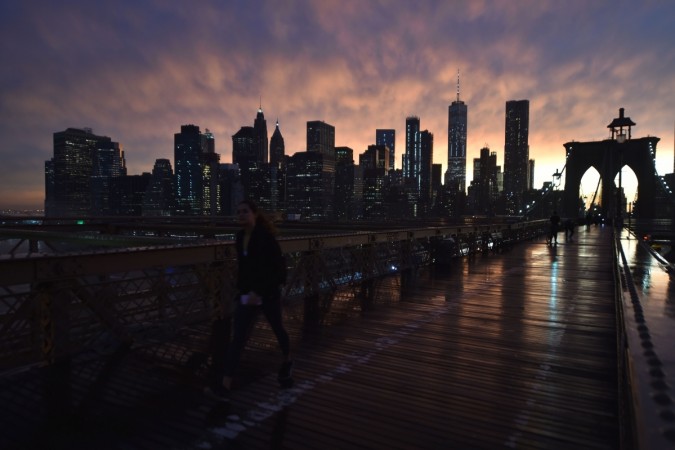 The Manhattan skyline is seen from the Brooklyn Bridge following a downpour in New York City New York