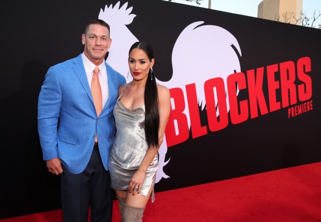 WESTWOOD, CA - APRIL 03: John Cena (L) and Nikki Bella attend the premiere of Universal Pictures' 'Blockers' at Regency Village Theatre on April 3, 2018 in Westwood, California. Nikki Bella