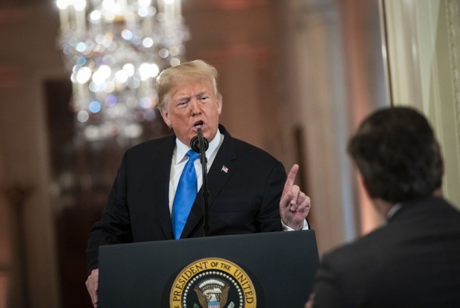 U.S. President Donald Trump gets into an exchange with CNN reporter Jim Acosta during a news conference a day after the midterm elections on November 7, 2018 in the East Room of the White House Donald Trump