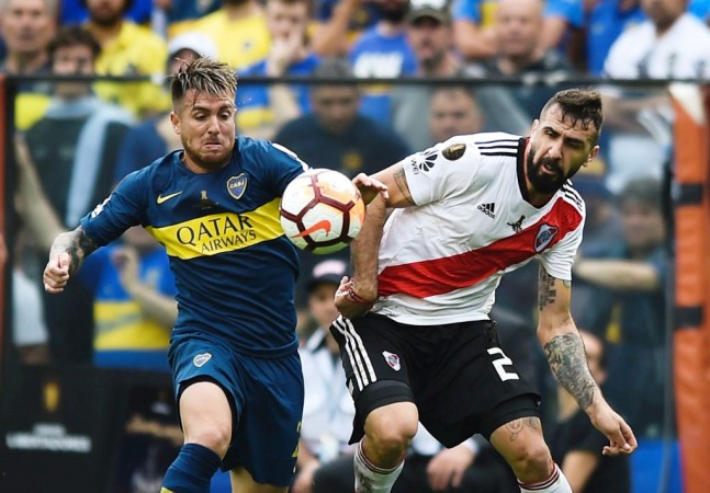 Julio Buffarini of Boca Juniors fights for the ball with Lucas Pratto of River Plate Boca Juniors vs River Plate