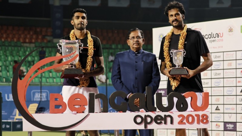 Champion Prajnesh Gunneswaran (left) and runner-up Saketh Myneni strike a pose with the Deputy Chief Minister of Karnataka Dr. G Parameshwara during the prize presentation of the Bengaluru Open ATP Challenger at the KSLTA on Saturday Bengaluru Open