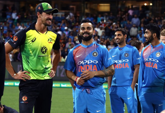 Kohli sharing a light moment with Starc (L) after the game in Sydney Mitchell Starc