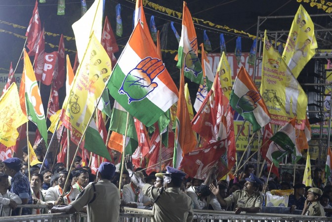 Indian supporters of grand alliance political parties waves at a rally for the campaign of the 2018 Telangana state Assembly elections in Hyderabad on November 28, 2018. - The Congress, TDP, Communist Party of India (CPI) and Telangana Jana Samiti (TJS) have formed a grand alliance for the Telangana Legislative Assembly election is scheduled to be held in Telangana state on 7 December 2018 to constitute the second Legislative Assembly. telangana elections