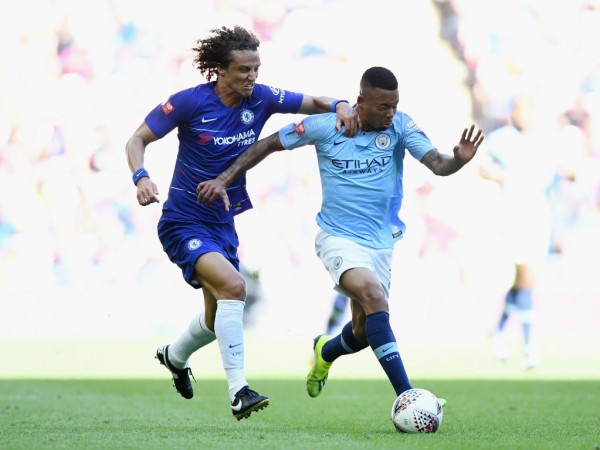 David Luiz (L) tussling with Gabriel Jesus (R) during the Community Shield match in August, 2018 Chelsea Manchester City