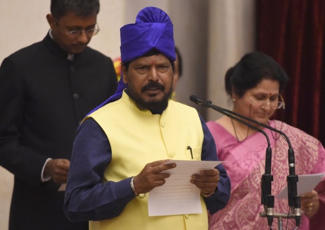 Indian member of Parliament Ramdas Athawale takes the oath during the swearing-in ceremony of new ministers following Prime Minister Narendra Modi's cabinet re-shuffle, at the Presidential Palace in New Delhi on July 5, 2016. Indian Prime Minister Narendra Modi revamped his cabinet on July 5 bringing in 19 new junior ministers to speed up decision-making and delivery on promises made in this year's budget. Ramdas Athawale