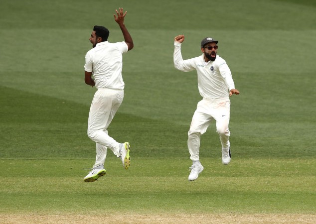 Kohli (R) celebrates with Ashwin (L) after the fall of Australia's last wicket at Adelaide Virat Kohli Ashwin