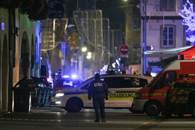 Policemen and emergency medical response vehicules are seen in the rue des Grandes Arcades in Strasbourg, eastern France, after a shooting breakout, on December 11, 2018. - A gunman killed at least four people and seriously injured another 11 near the famed Christmas market in the French city of Strasbourg before fleeing the scene, security officials said. Police launched a manhunt after the killer opened fire at around 7pm local time (1800 GMT), sending crowds of evening shoppers fleeing for safety. Terror attack at the Christmas market in the French city of Strasbourg