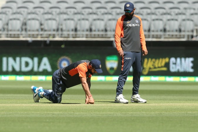 Kohli (L) and Shami (R) inspect the pitch at Perth Virat Kohli Mohammed Shami India cricket team