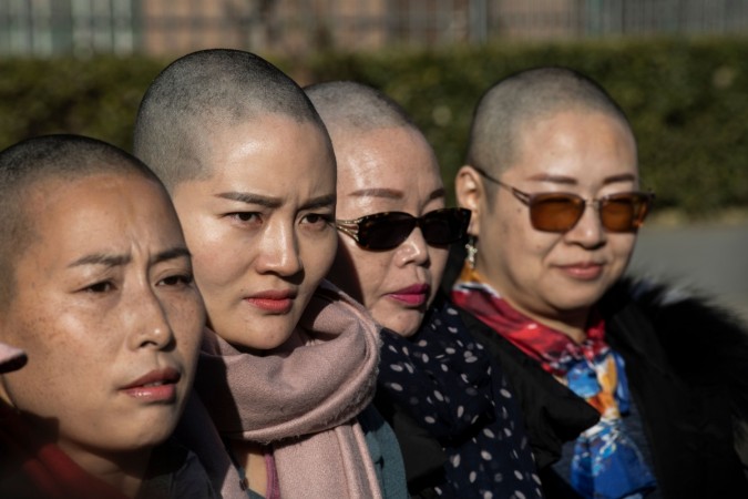 Yuan Shanshan, Li Wenzu, Liu Ermin and Wang Qiaoling speak to the media after they shaved their heads to protest the detention of their husbands, detained during the 709 crackdown Chinese activists