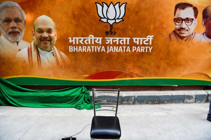 An empty chair is kept against the banner of Bharatiya Janata Party (BJP) at the party headquarters in New Delhi on December 11, 2018. (Photo by CHANDAN KHANNA / AFP) Bharatiya Janata Party (BJP)