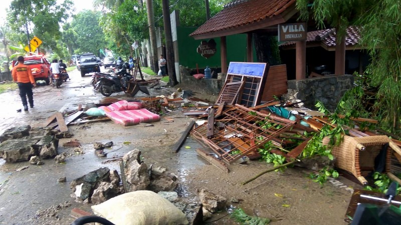 Debris from damaged buildings is seen on a street on Carita beach on December 23, 2018, after the area was hit by a tsunami on December 22 that was triggered by an eruption of the Anak Krakatoa volcano. tsunami indonesia