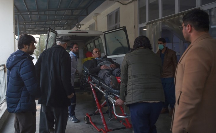 A wounded Afghan man is wheeled on a stretcher at the Wazir Akbar Khan hospital, after a car bomb attack, in Kabul on December 24, 2018. - Militants detonated a car bomb before storming a Kabul government compound in an ongoing attack on December 24, officials and witnesses said, in the latest violence to rock the Afghan capital. A number of gunmen have entered the compound where the Ministry of Public Works and an office of the Ministry of Labor, Social Affairs, Martyrs and Disabled are located, interior ministry deputy spokesman Nasrat Rahimi said. (Photo by WAKIL KOHSAR / AFP) AFGHANISTAN-UNREST