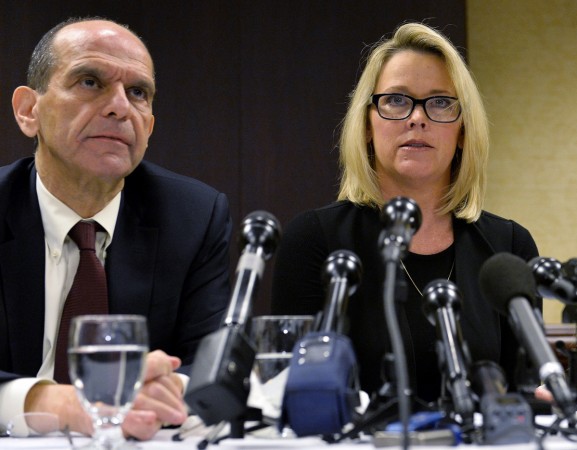 Former Boston news anchor Heather Unruh (R) sits with her attorney Mitchell Garabedian at a press conference in Boston November 8, 2017 during which she accused actor Kevin Spacey of allegedly sexually abusing her son in July 2016 at the Club Carr restaurant on Nantucket Island. Projects are shelved, film releases cancelled, sets shuttered, studios threatened, the Oscars rattled -- this is the chaos confronting Hollywood following sex scandals that have brought down power players like Harvey Weinstein, Kevin Spacey and Brett Ratner. / AFP PHOTO / Joseph PREZIOSO US-ENTERTAINMENT-FILM-ASSAULT