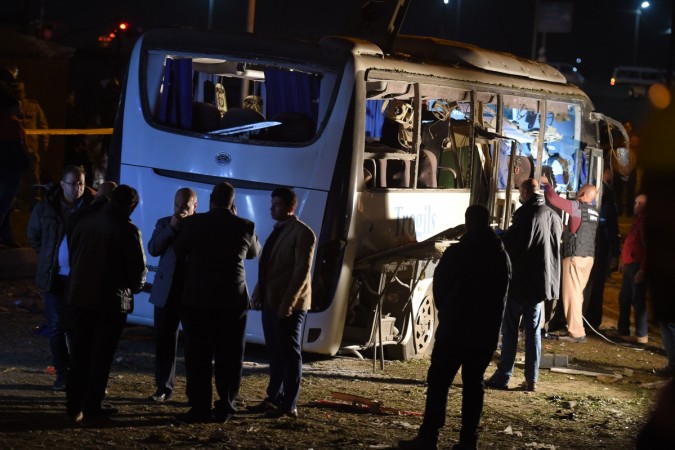 This picture taken on December 28, 2018 shows a view of a tourist bus which was attacked in Giza province south of the Egyptian capital Cairo. - Two Vietnamese holidaymakers and an Egyptian tour guide were killed and 10 others wounded on December 28 when a roadside bomb exploded near their bus as it travelled close to the Giza pyramids in Cairo, Egypt's interior ministry said in a statement. giza blast