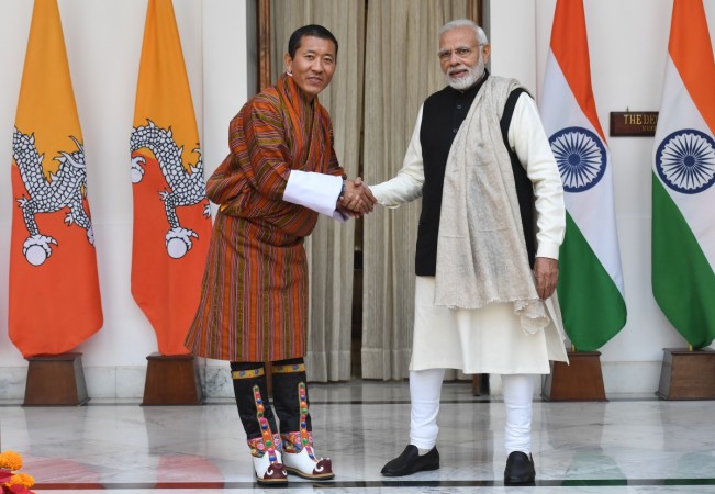 Indian Prime Minister Narendra Modi (R) shakes hands with Bhutan's Prime Minister Lotay Tshering prior to a meeting in New Delhi on December 28, 2018. modi bhutan