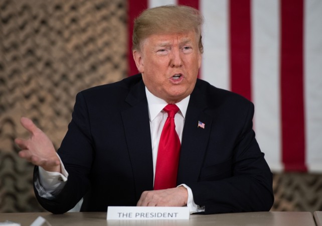 US President Donald Trump speaks at a military briefing during an unannounced trip to Al Asad Air Base in Iraq on December 26, 2018. - President Donald Trump arrived in Iraq on his first visit to US troops deployed in a war zone since his election two years ago (Photo by SAUL LOEB / AFP) US President Donald Trump