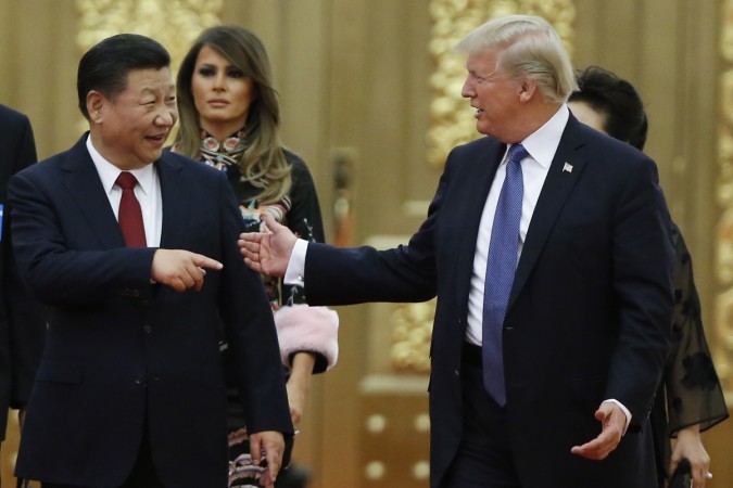 China's President Xi Jinping and US President Donald Trump arrive at a state dinner at the Great Hall of the People on November 9, 2017 in Beijing, China. The receding fears of a US-China trade war are helping to buoy global markets and Indian sentiment. U.S. President Trump Visits China